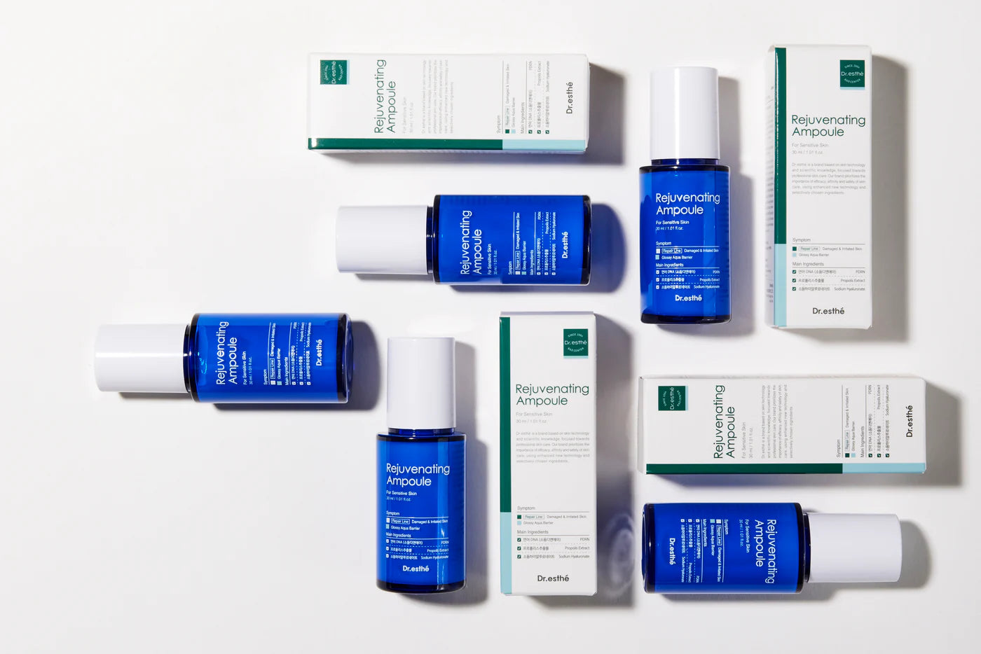 Collection of skincare products including bottles and boxes on a white background