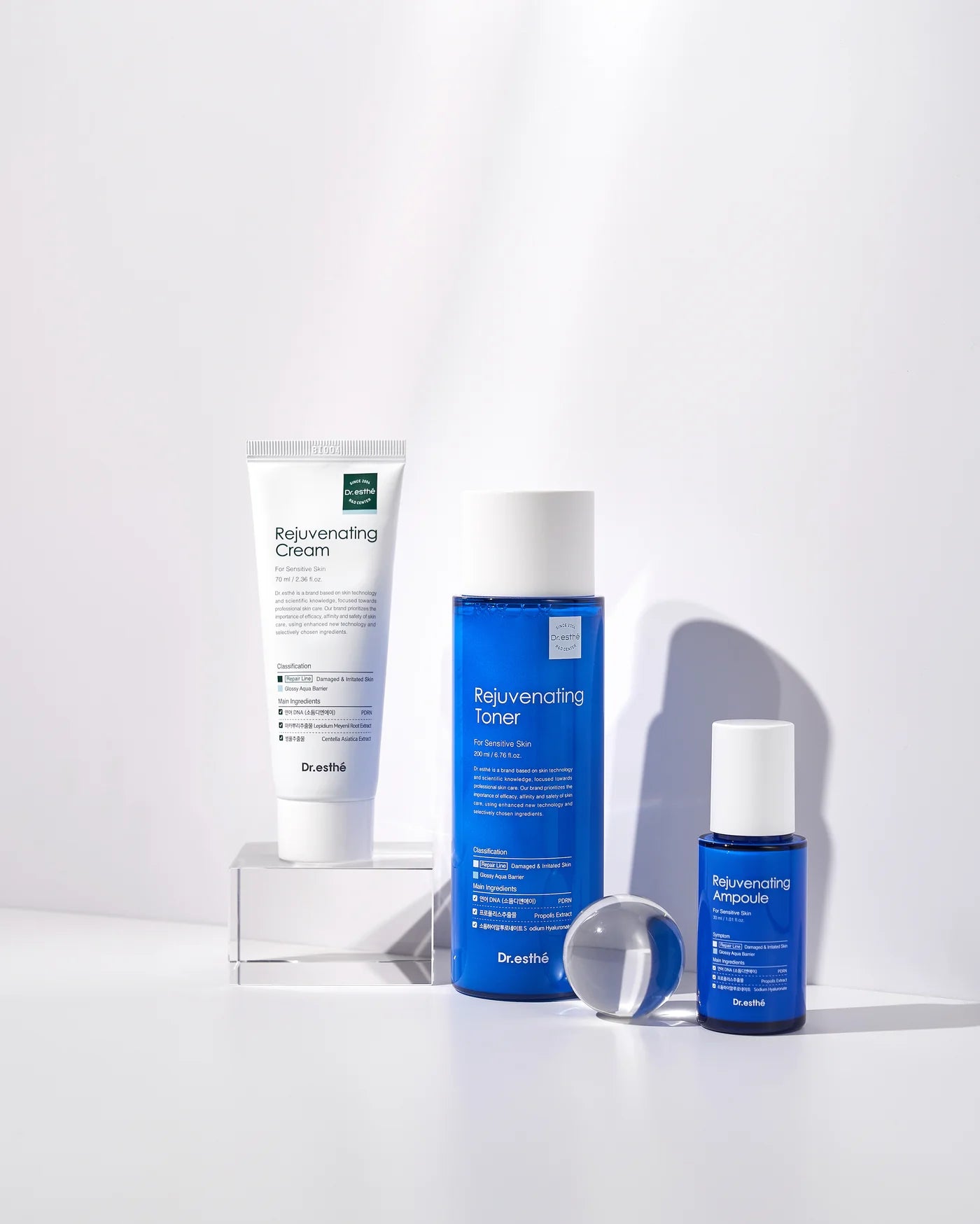 Dr. Esthe skincare products including cream, toner, and ampoule on a white background
