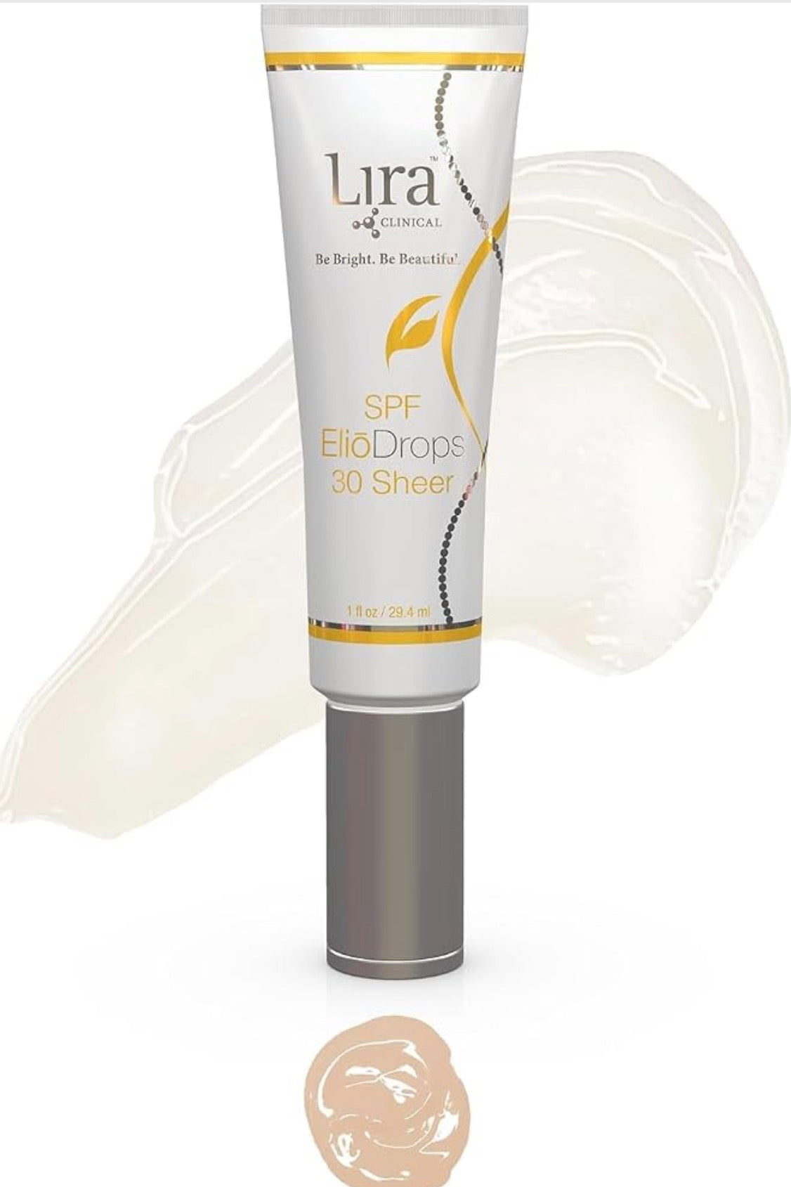 Lira Clinical SPF ElioDrops 30 Sheer sunscreen tube with a silver cap, shown against a white background with a translucent cream smear and a beige swatch below.